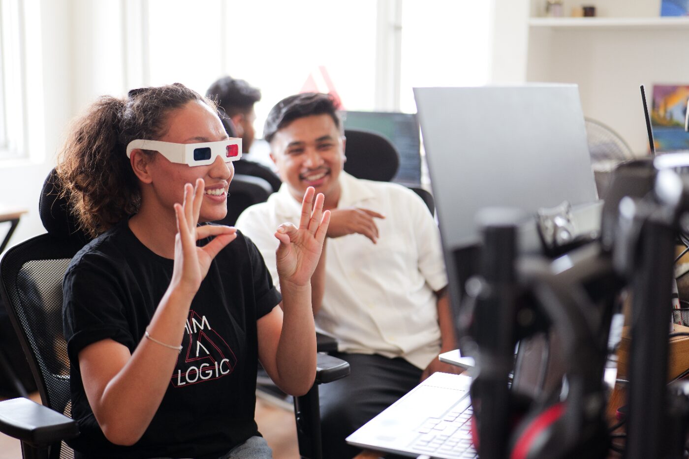 Two engineers testing an AR build with anaglyph glasses